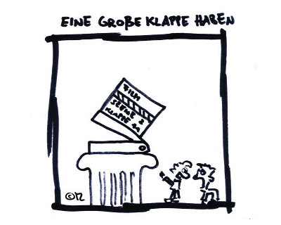 eine große Klappe haben